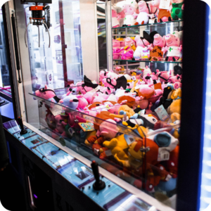 Claw machine filled with plush prizes