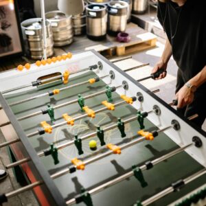 Group of people playing foosball